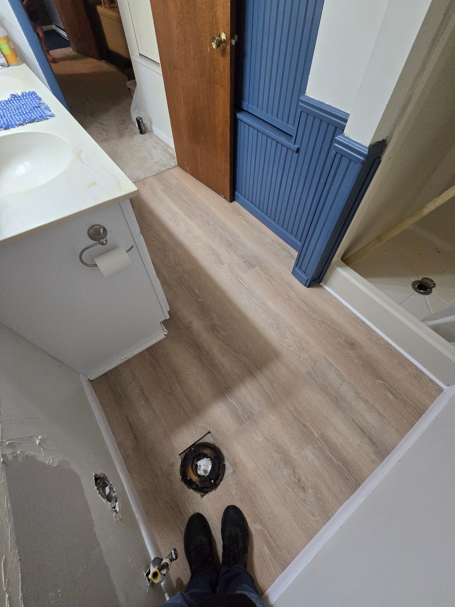 During — installed flooring before fixtures are reset