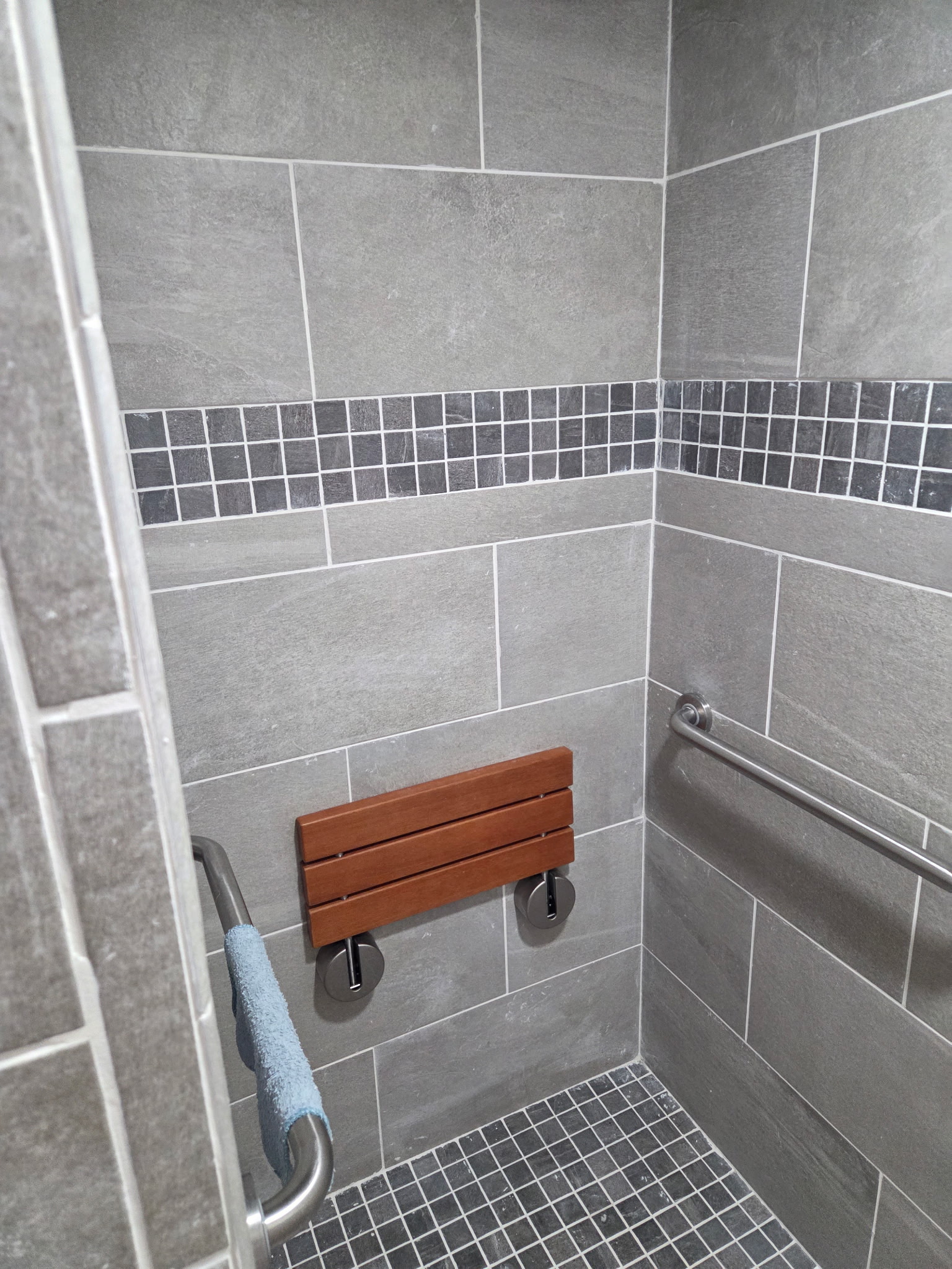 Completed shower tile and bench detail